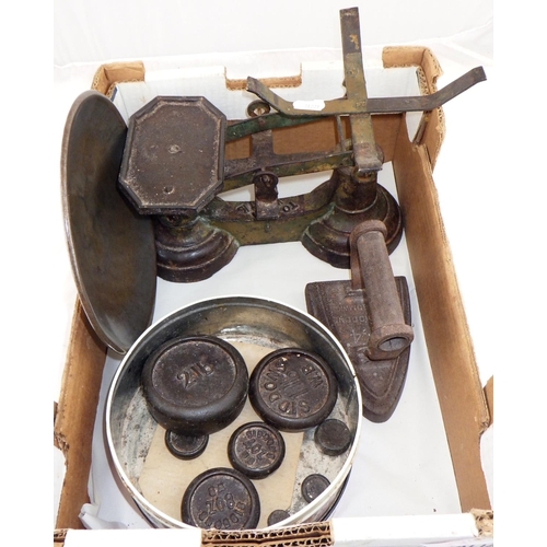 11 - An iron kitchen scales with associated weights.