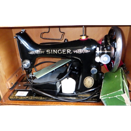 32 - A Singer sewing machine, a qty of framed pictures, a slide projector etc. (4)