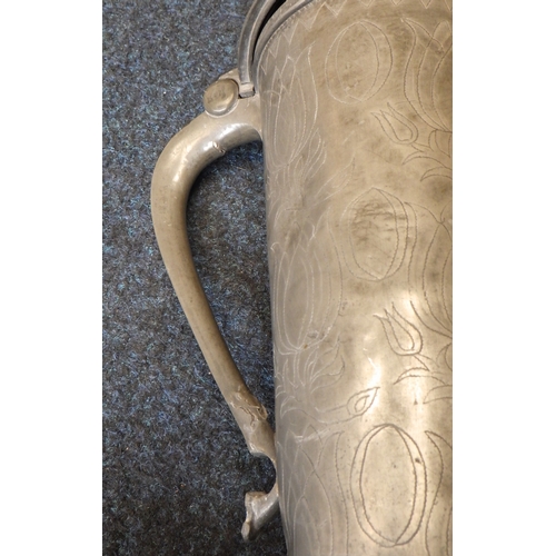 47 - A large pewter tankard / flagon of tall cylindrical form with floral wriggle work decoration. 37cm t... 