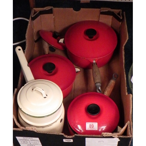 89 - Three red Le Creuset sauce pans together with an enamel pan, used