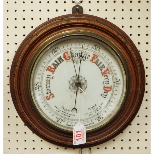 101 - A carved oak Aneroid barometer 30cm diameter