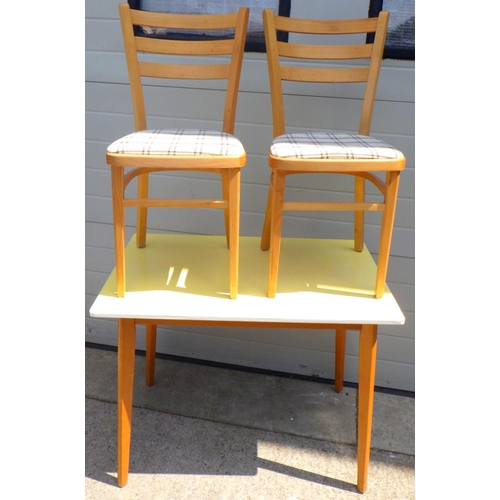 835 - A formica top kitchen table and two chairs (3)