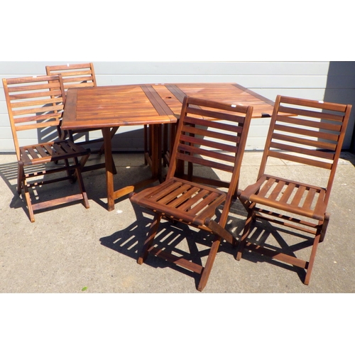 682 - A teak drop leaf garden table & four chairs (5)