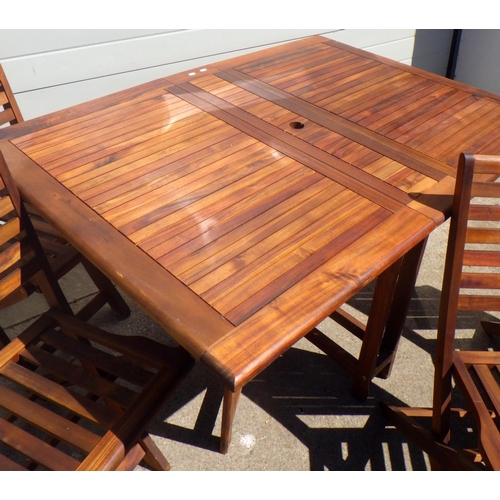 682 - A teak drop leaf garden table & four chairs (5)