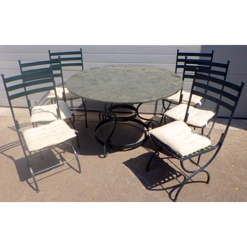 685 - A circular table, 128cm across together with six metal chairs (7)