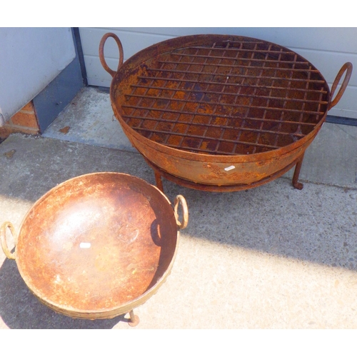 702 - Two fire pits, one missing grille, largest 60cm across