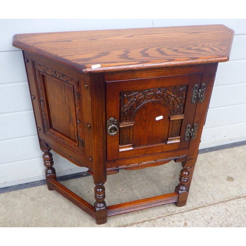 705 - An Old Charm panelled oak credence cupboard, 82cm wide