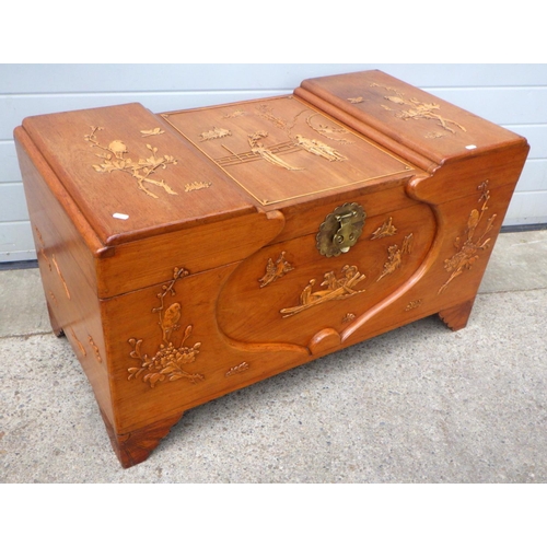 708 - A carved camphorwood chest, 105cm wide