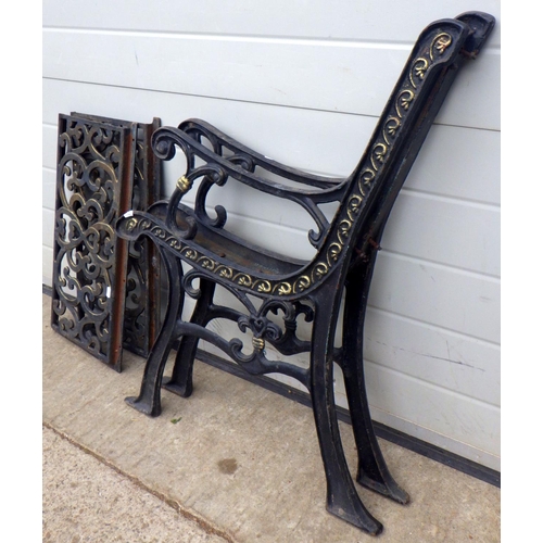 710 - A pair of cast iron bench ends