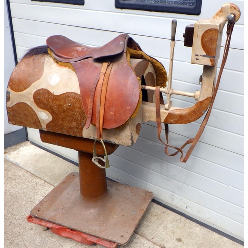 713 - A horse riding training machine, approx 140cm tall, sold as seen in need of re-wire, smokes