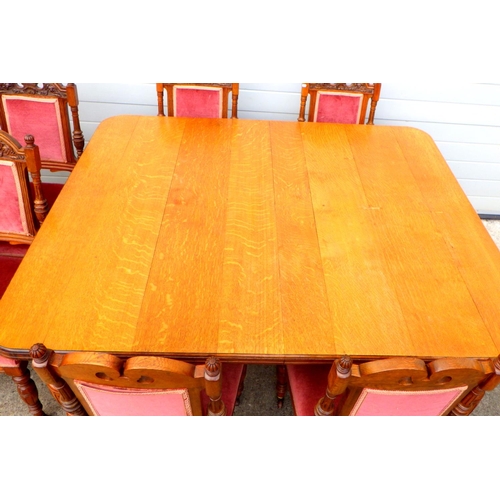 773 - A late Victorian oak wind out dining table 162cm long, with a later leaf, together with a set of eig... 