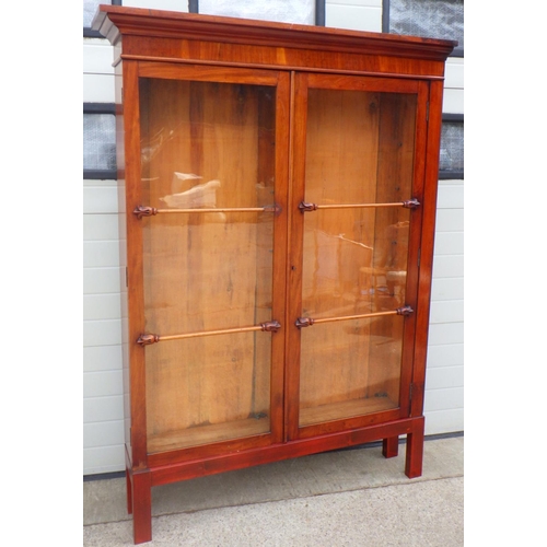 775 - A Victorian mahogany bookcase section on a later base, one side not finished, 143cm wide