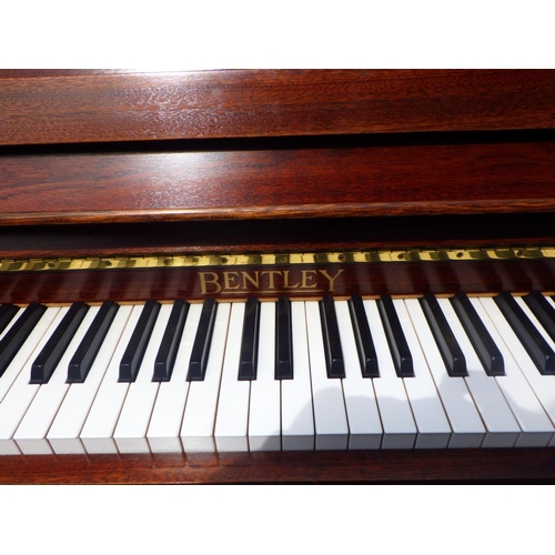 778 - A modern Bentley upright piano, 144cm wide