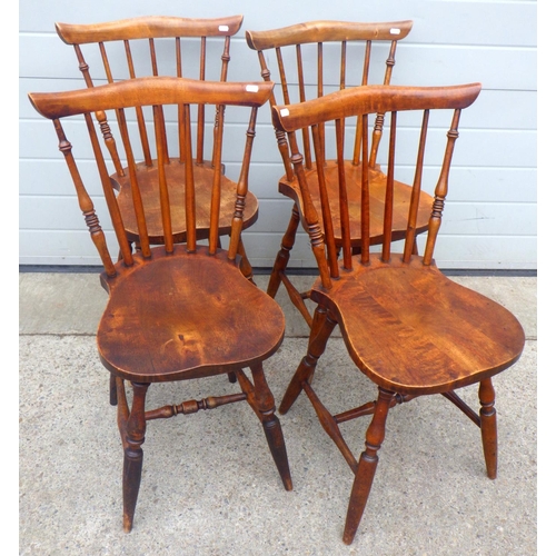 817 - A set of four spindle back kitchen chairs