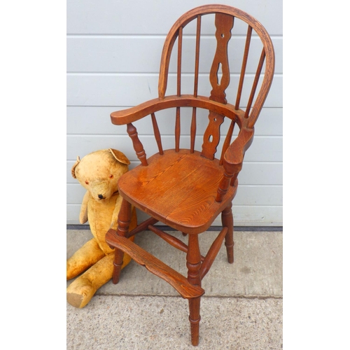 821 - A reproduction Windsor child's chair together with a large jointed teddy bear, worn (2)