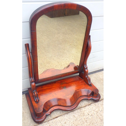 824 - A Victorian mahogany toilet mirror, 63cm wide