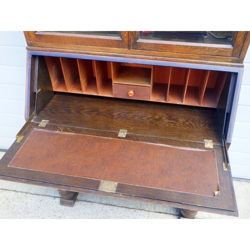 851 - An oak bureau bookcase 91cm wide