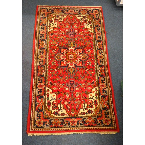 839 - A hand knotted red rug