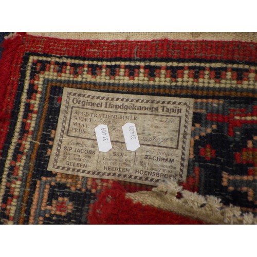 839 - A hand knotted red rug