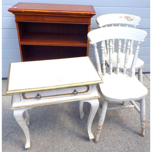 630 - A white painted low side table together with a pair of painted chairs and a low bookcase (4)