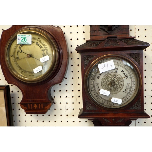 26 - An Edwardian inlaid barometer together with a late 19thC carved walnut barometer (2)