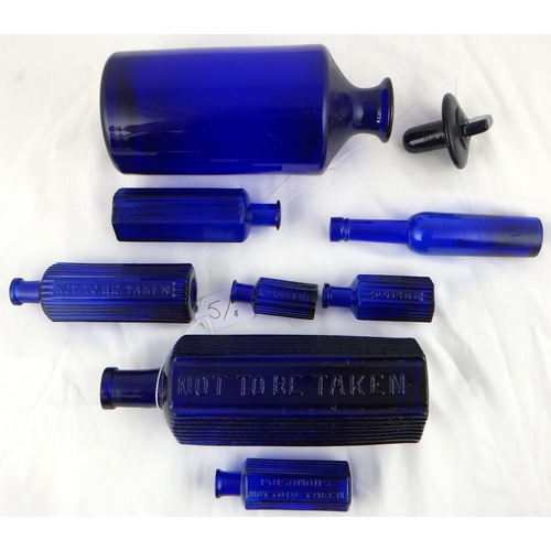 5 - A group of eight blue glass poison bottles