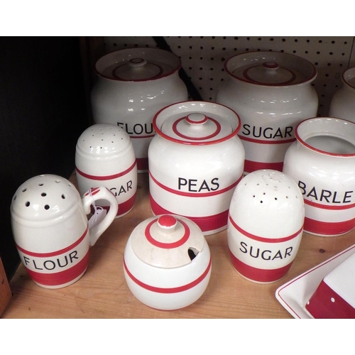 103 - A collection of Sadler Kleen Kitchen Ware storage jars and kitchen pottery, having red painted band ... 