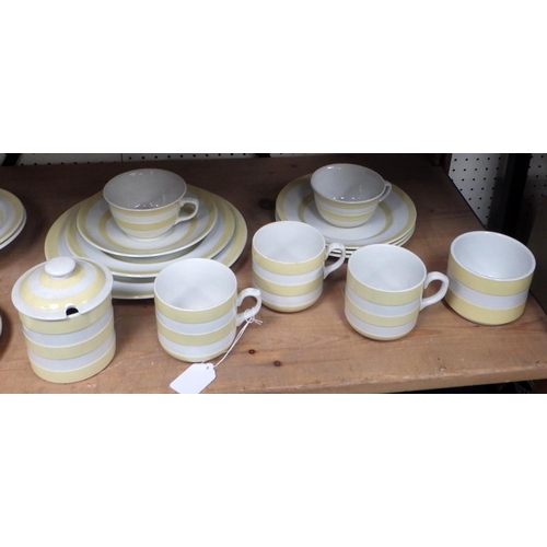 104 - A collection of T G Green Cornish Kitchen Ware yellow detail storage jars and kitchenware. A/F