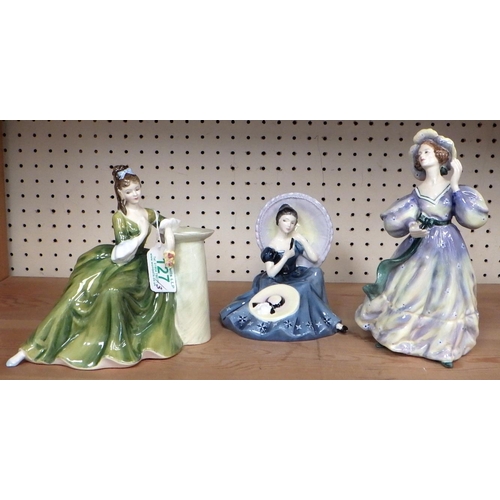 127 - Three Royal Doulton lady figurines.