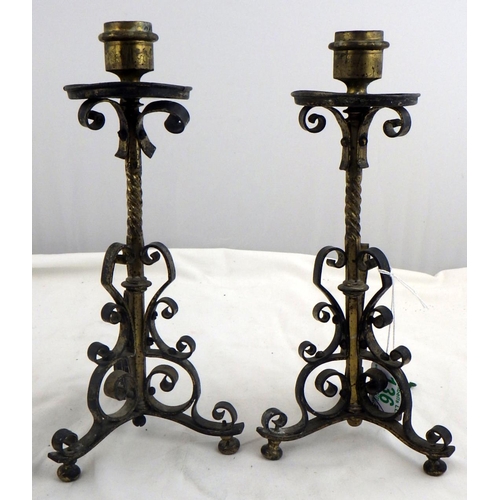 136 - A pair of openwork candlesticks, a/f ,  27cm tall; a single brass candlestick in medieval manner.  E... 