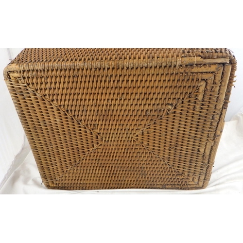 141 - A wicker storage basket having brass hinges and lock hasp.