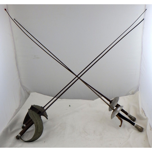 143 - A pair of fencing rapiers together with two fencing foils. (4)
