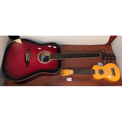162 - A Valencia acoustic guitar; a ukulele.  (2)