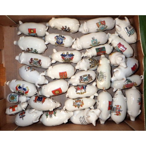 170 - A collection of crested ware souvenir pig figurines.