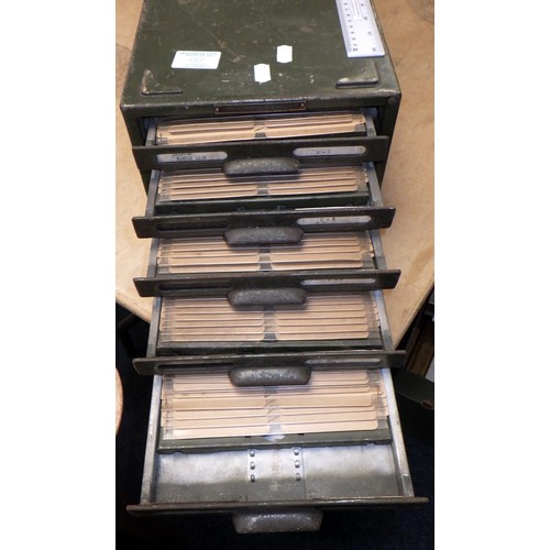 87 - A set of long green metal card filing drawers.