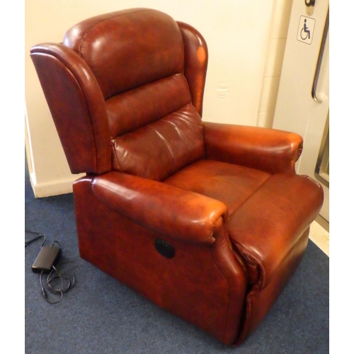 642 - A modern brown leather reclining electric arm chair