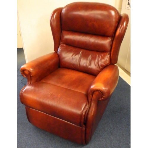 642 - A modern brown leather reclining electric arm chair