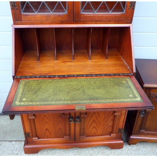 645 - An oak bureau bookcase together with a  matching side cupboard (2)