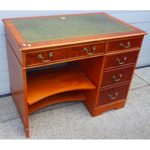 647 - A reproduction yew leather top desk