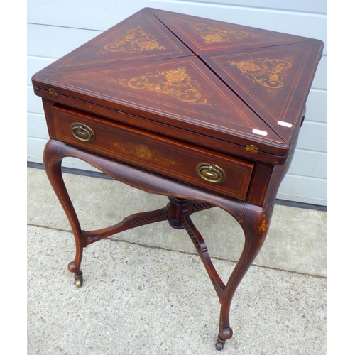 665 - A late Victorian mahogany inlaid envelope card table