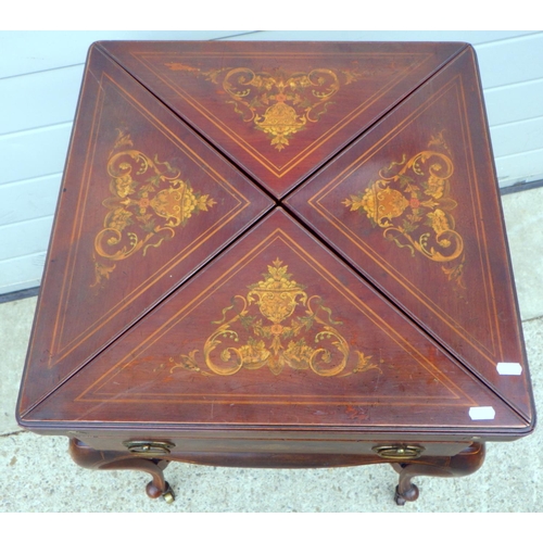 665 - A late Victorian mahogany inlaid envelope card table