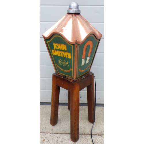 667 - A John Smith's lamp top attached to a stool base