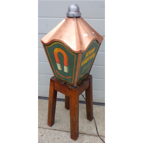 667 - A John Smith's lamp top attached to a stool base