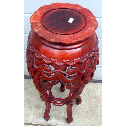 674 - A Oriental carved jardinere stand 68cm high