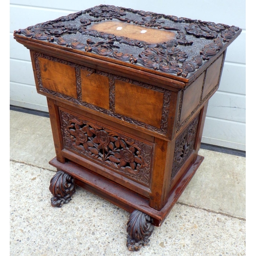 675 - A Oriental carved cupboard 50cm wide