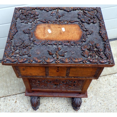 675 - A Oriental carved cupboard 50cm wide