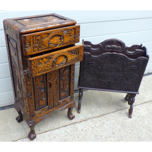 677 - A Oriental carved cupboard together with a carved magazine rack (2)