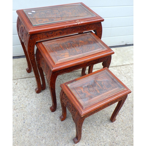 678 - An Oriental carved nest of three tables af