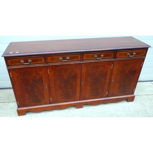 683 - A reproduction mahogany four door sideboard