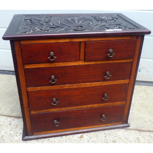 694 - A 19th century miniature chest of drawers with carved top 43 x 40cm